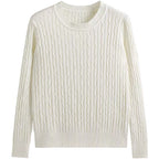An off-white cable-knit crewneck sweater with long sleeves, ribbed collar, cuffs, and hem, displayed on a solid white background.