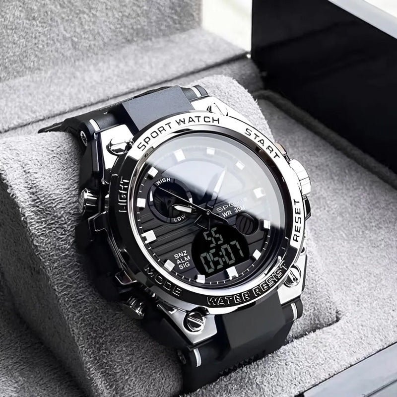 Black and silver sports watch on a soft gray surface