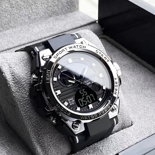 Black and silver sports watch on a soft gray surface