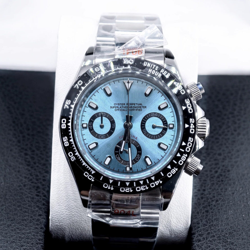 Luxury watch with a blue face and silver case on a black textured background