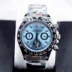 Luxury watch with a blue face and silver case on a black textured background