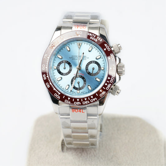 Luxury watch with a blue face and silver case on a white background