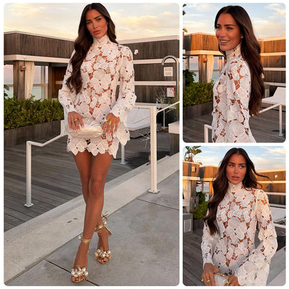 Woman in a white lace dress on a rooftop with a scenic background