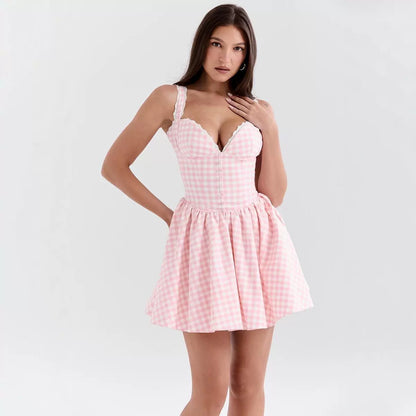 Woman wearing a pink checkered dress on a white background