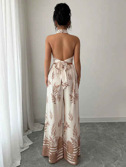 Woman wearing a strapless floral jumpsuit in a minimal indoor setting