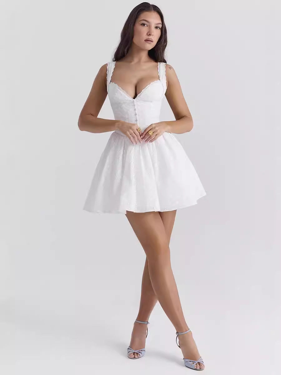 Woman wearing a white dress on a light gray background