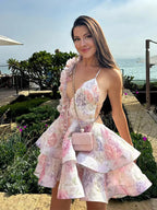 women dressed in a floral dress with the sea in the background fashionvelvet